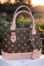 Load image into Gallery viewer, BROWN STAR PRINTED PURSE WITH PINK TRIM.
